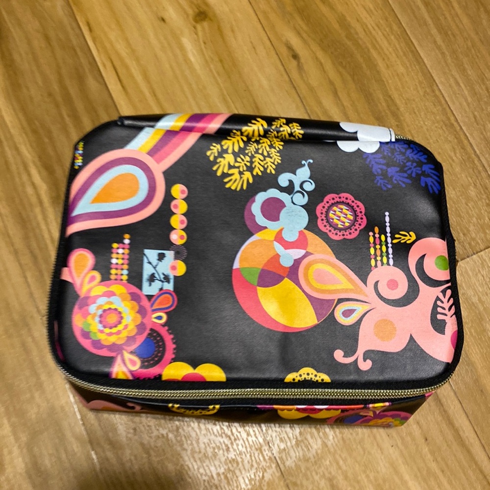 amika makeup bag; 9x6; zippers all around the bag